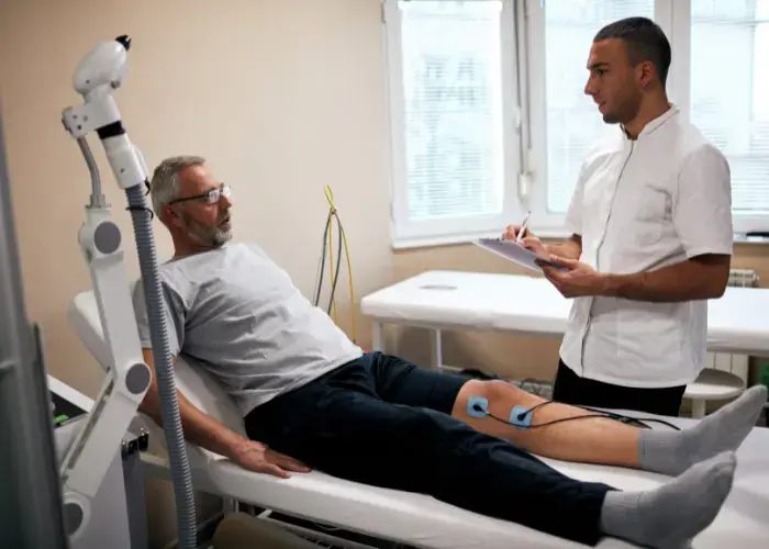 a doctor treating patient with TENS Therapy In Mumbai